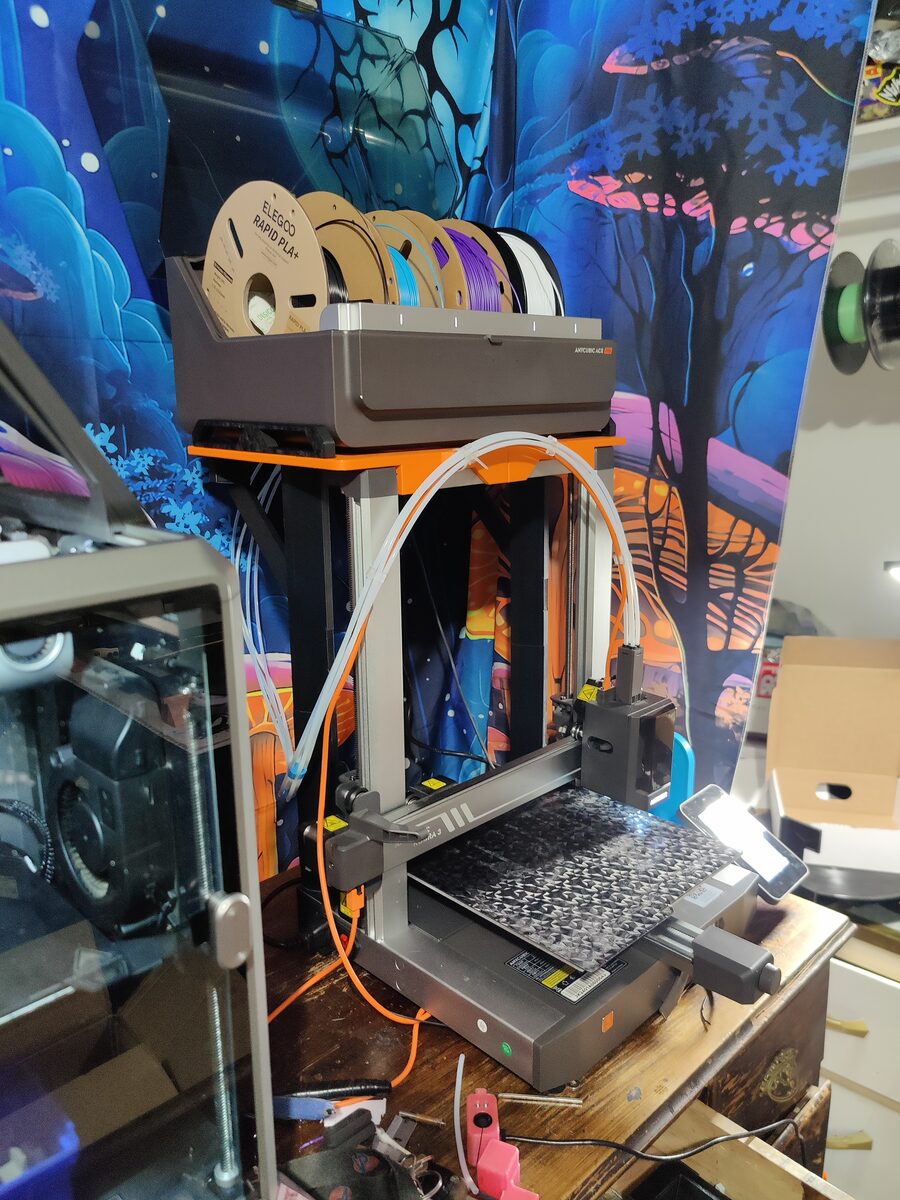 Multi-spool filament rack with a range of materials loaded and ready